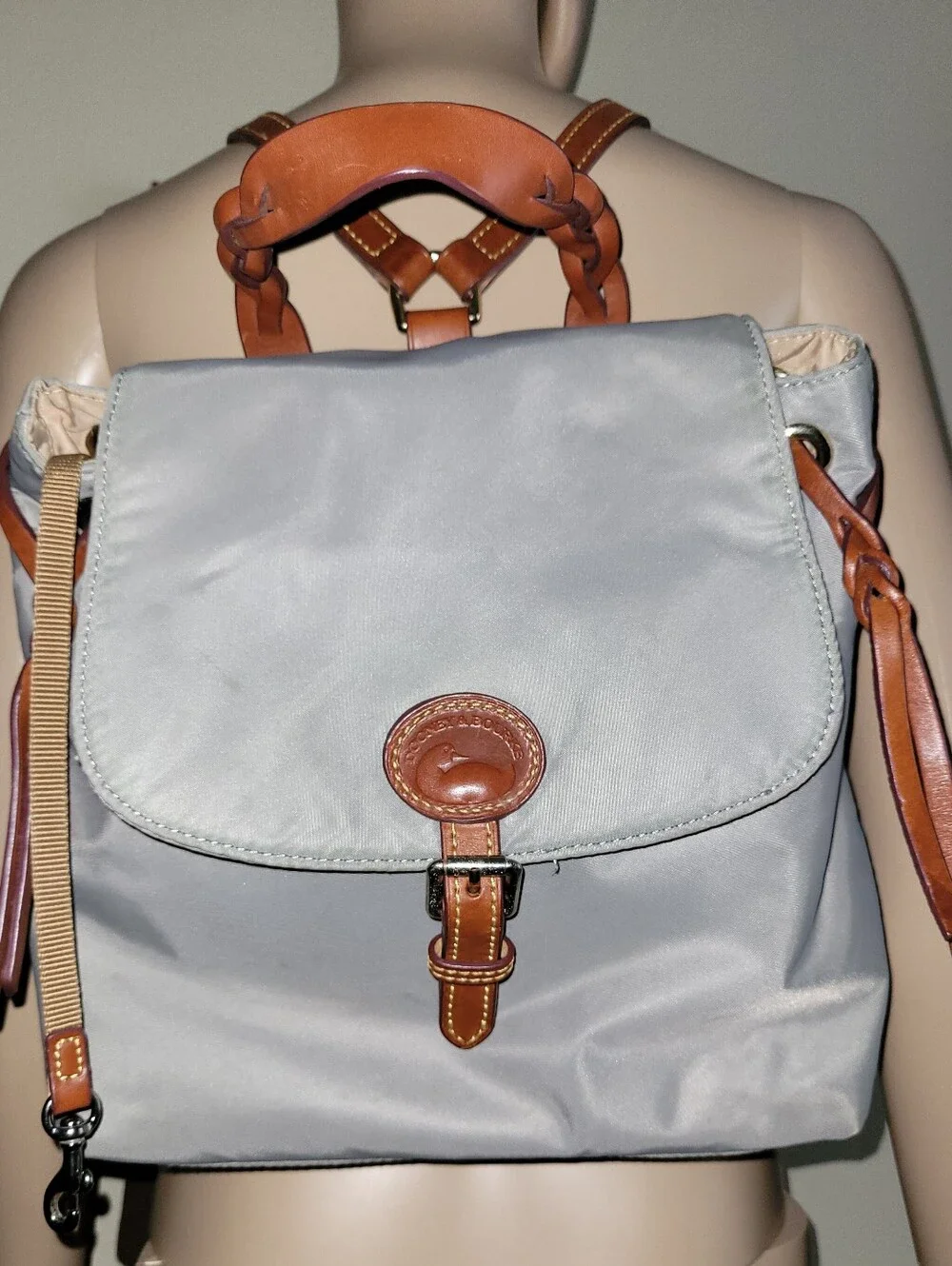 Dooney & Bourke Light Gray Nylon Backpack with Brown Leather Trim.